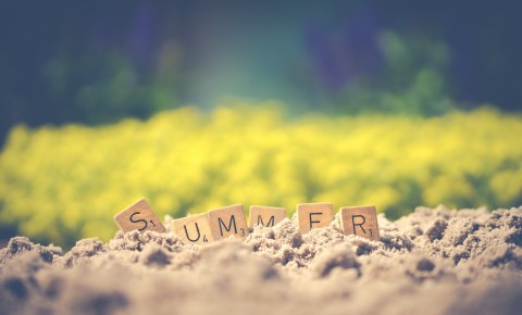 "Summer" Written Out in Scrabble Tiles in the Sand